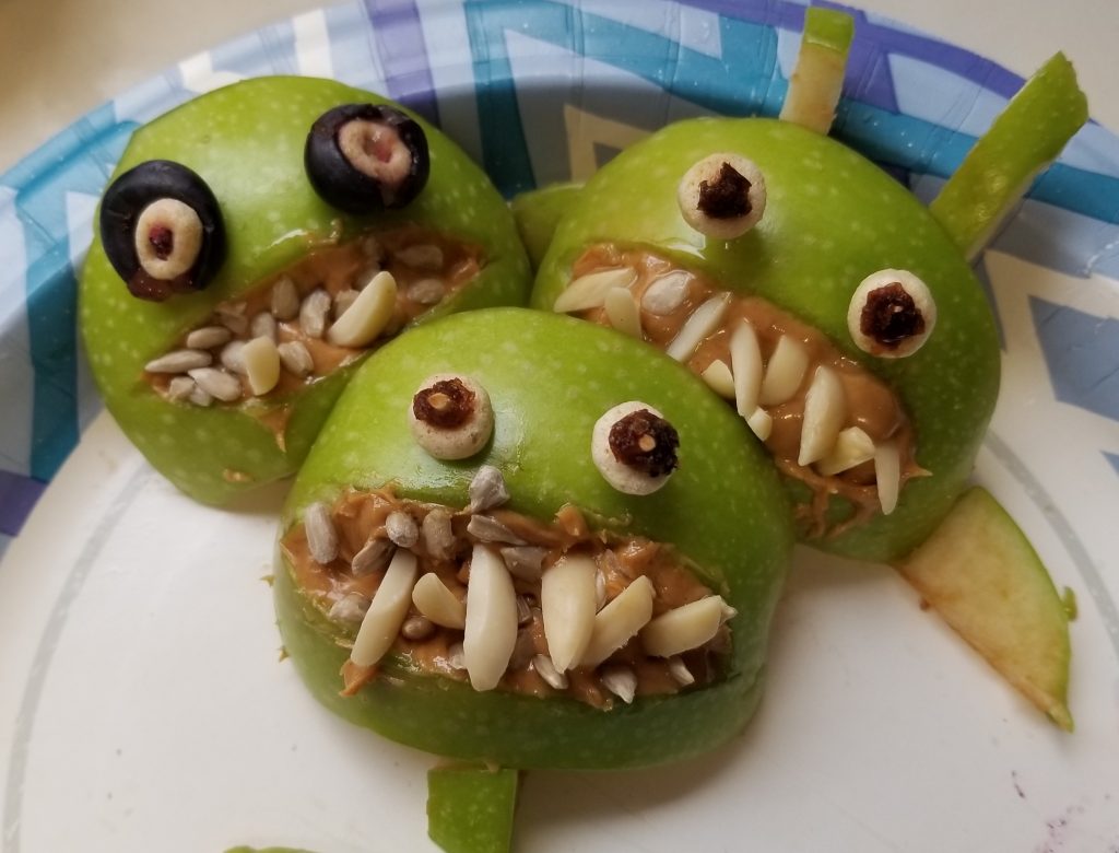 healthy healthy green apples made with peanut butter, Sunflower seeds.
