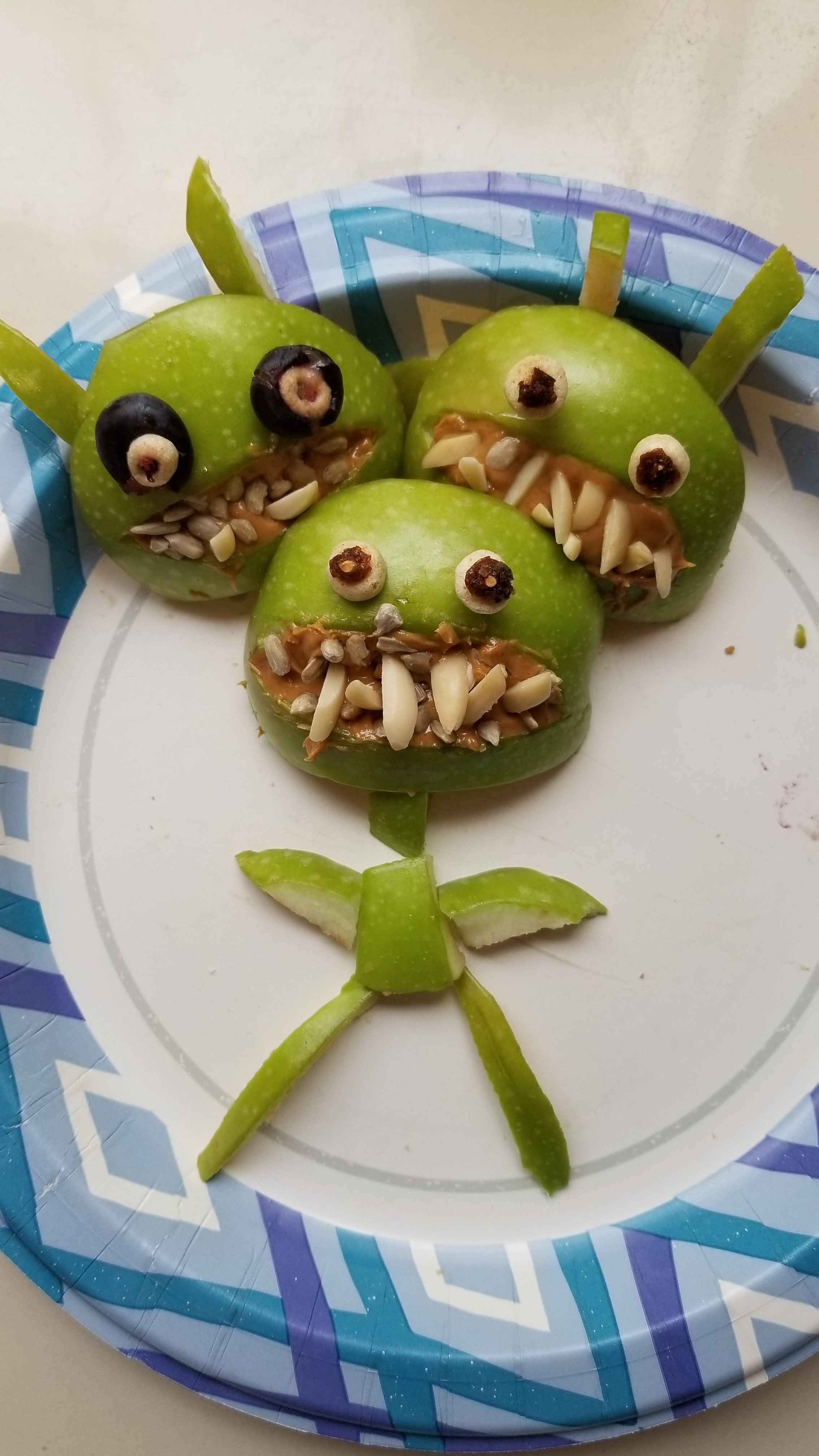 healthy healthy green apples made with peanut butter, Sunflower seeds.